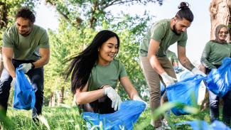 College students doing a service project in nature